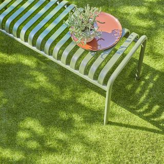 artificial grass green bench plant on brown dish