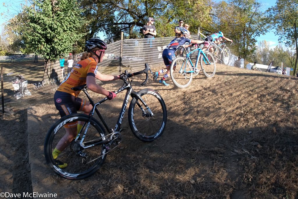Amanda Miller (Boulder Cycle Sport) running some steps behind Caroline Mani and Courtenay McFadden