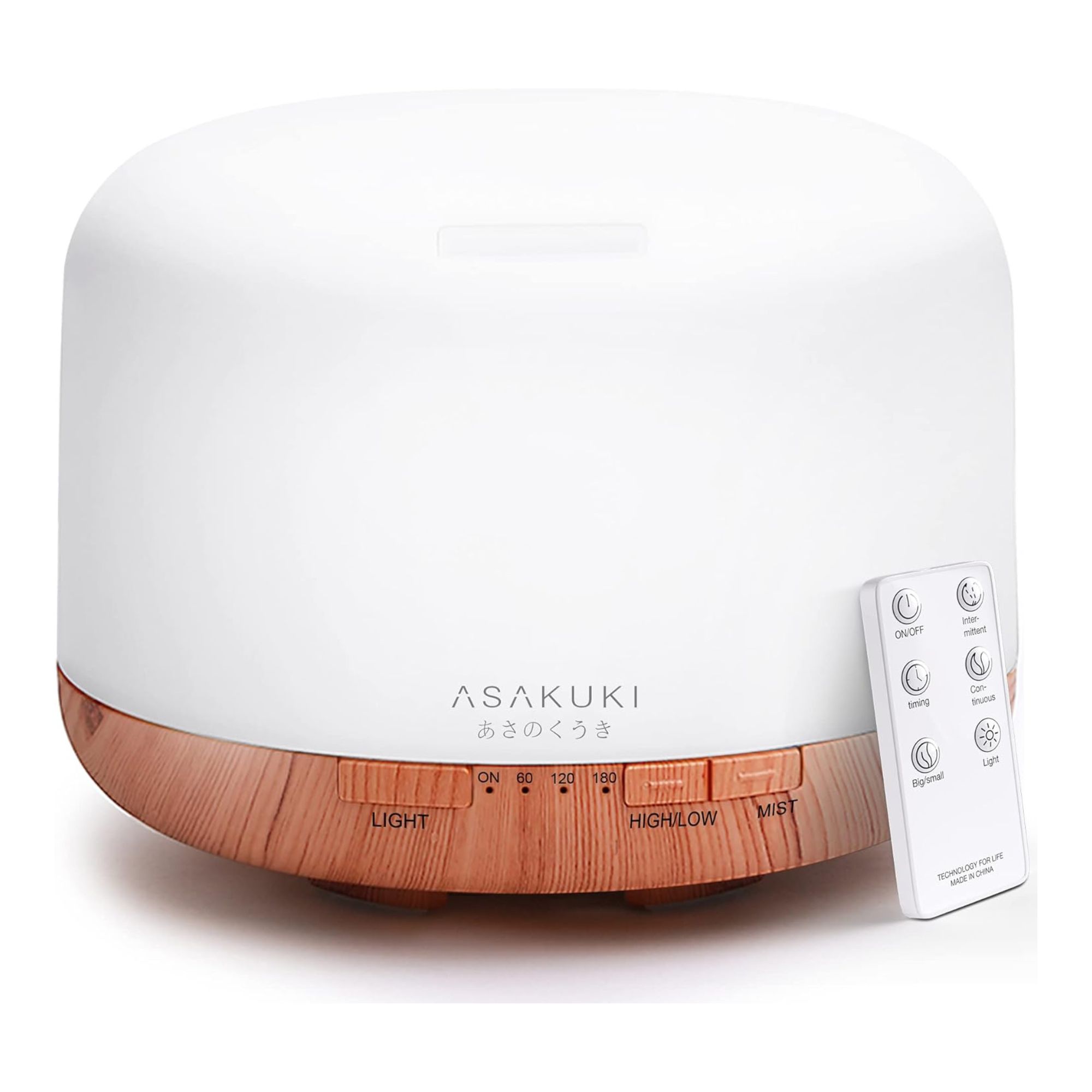White plastic oil diffuser with wood-effect base and white remote control