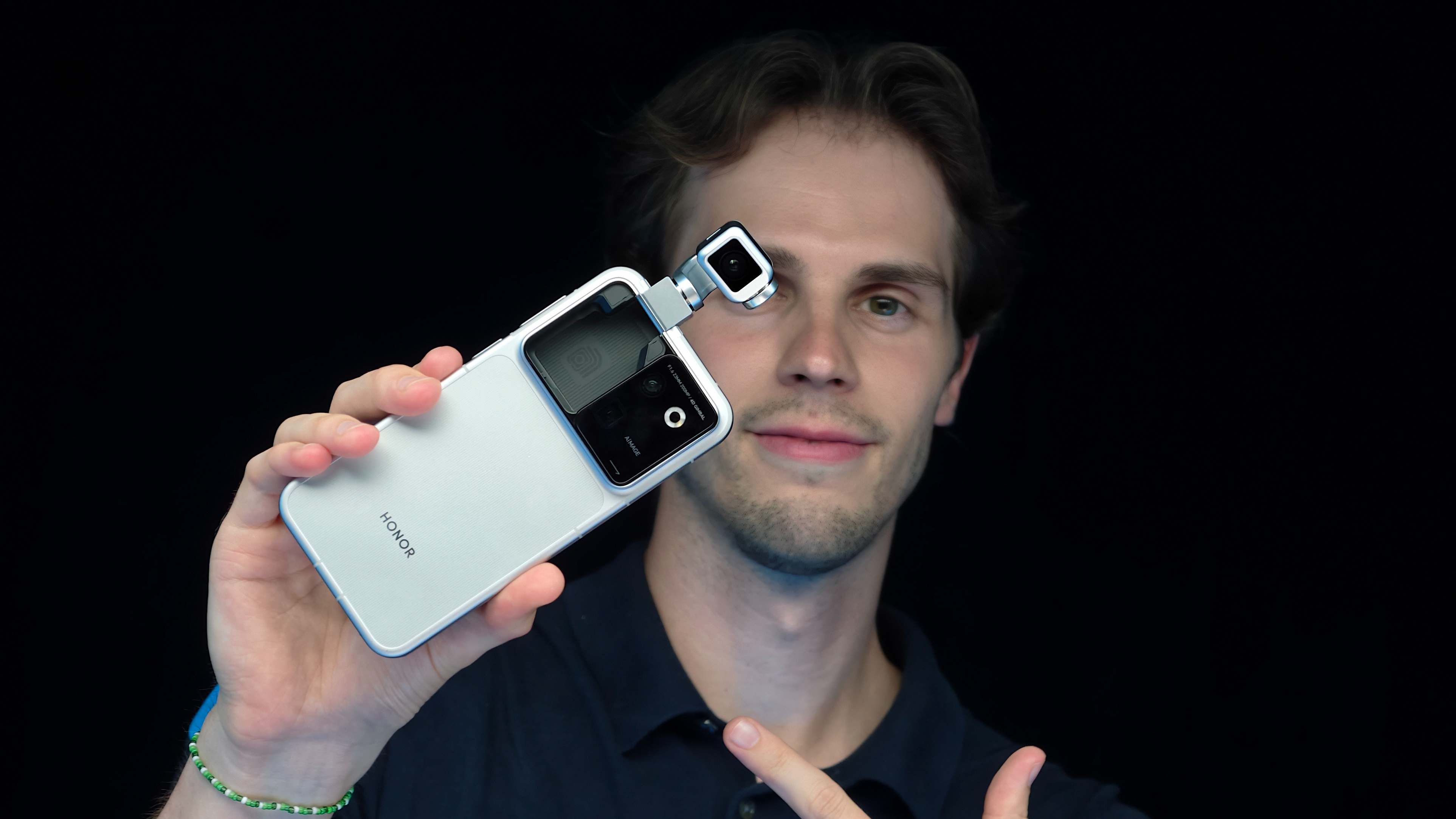 A man holding the Honor Robot Phone in his hand