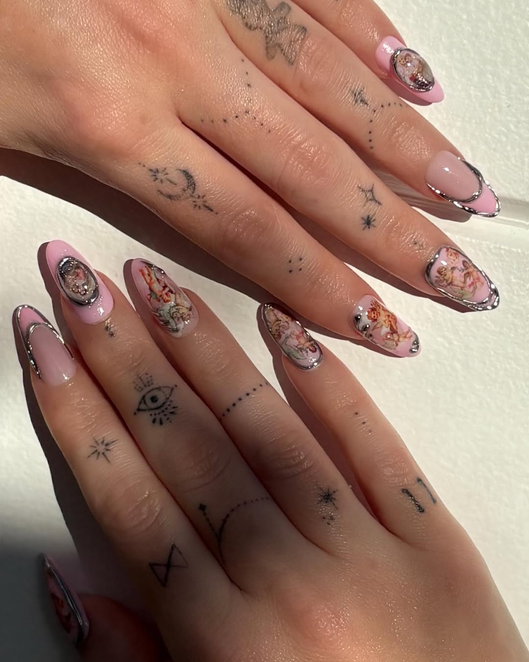 A whimsical cherub and fairy-inspired manicure by Brittney Boyce