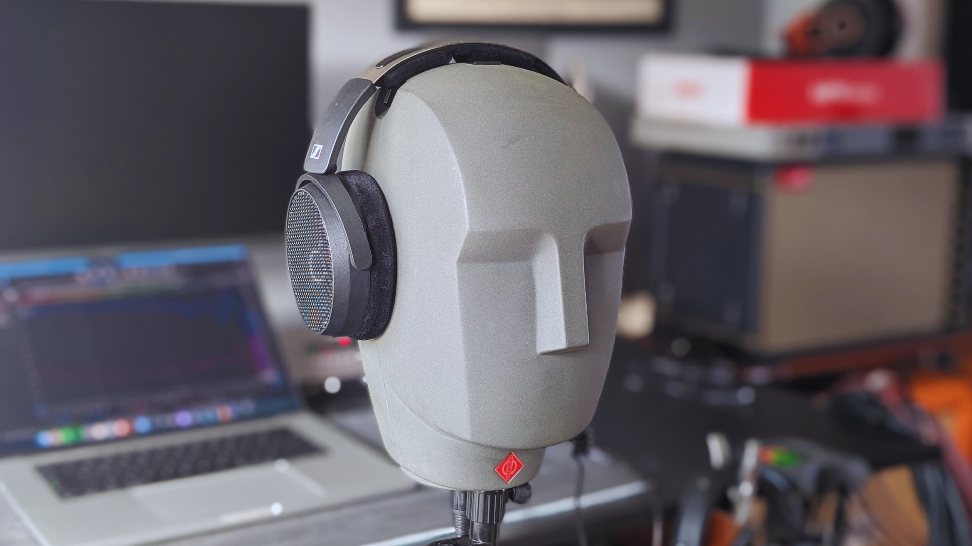 A pair of Sennheiser HD 490 Pro studio headphones on a Neumann KU 100 dummy head