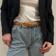 Eliza Huber wearing a white t-shirt, jeans, and a brown-and-gold Madewell belt.