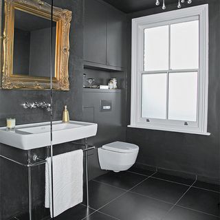 bathroom with washbasin and black wall and white window and black tiles flooring
