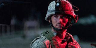 The Outpost Scott Eastwood in battle gear, bathed in red light