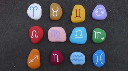 Astrology Signs Pebbles On Table