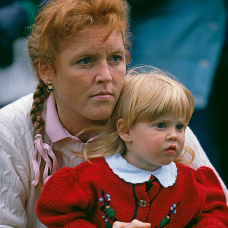 Sarah Ferguson, Duchess of York holding her daughter Princess Beatrice of York at the Royal Windsor Horse Show