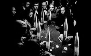 people around a poker table with rockets on