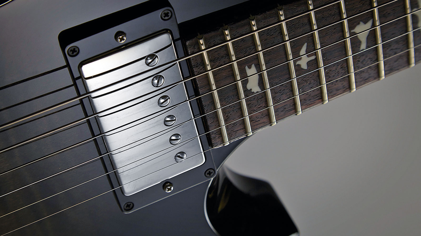 The neck 'bucker has a more open sound in the midrange with cloudy lower mids