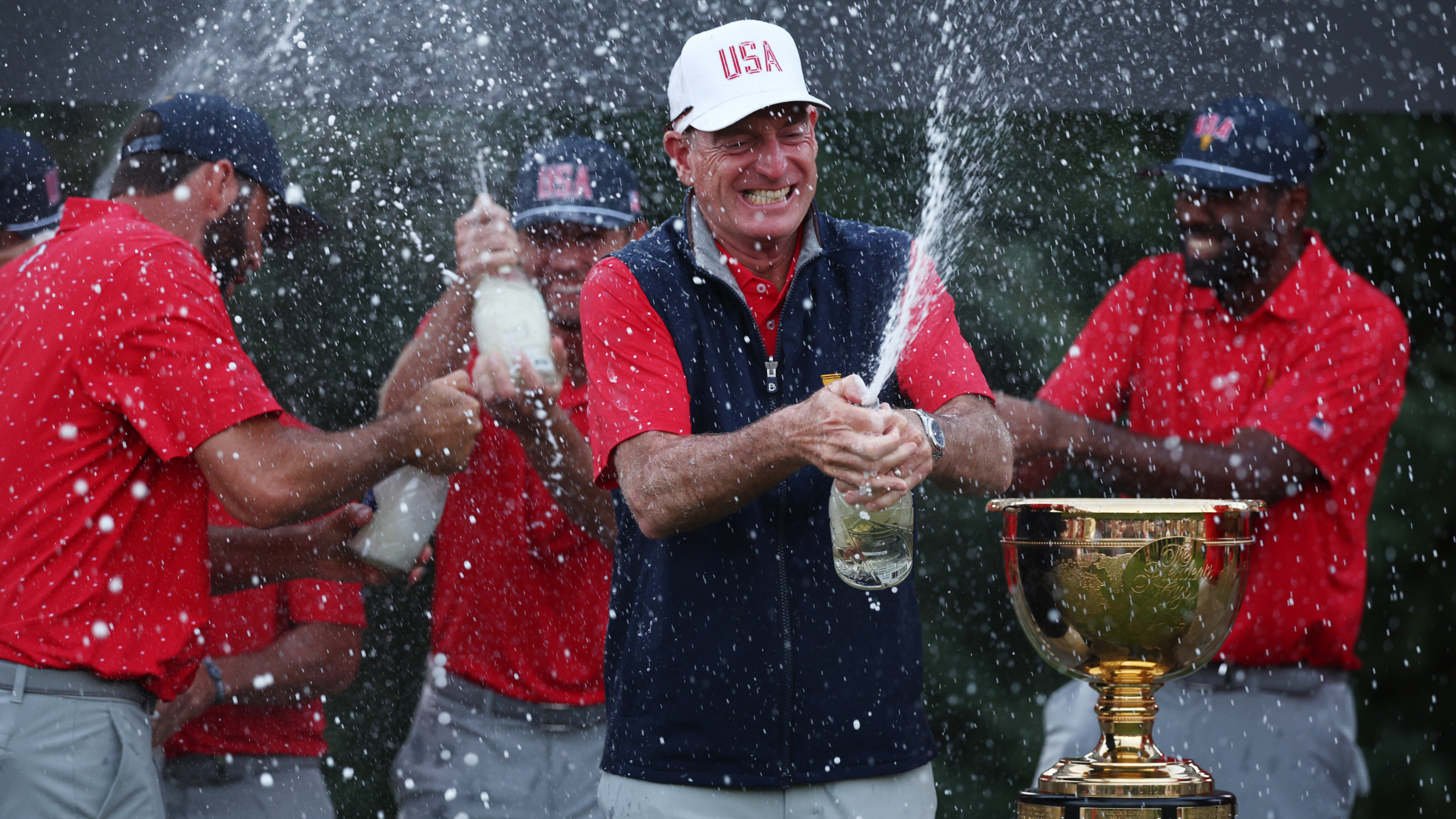 Jim Furyk and the US team celebrate winning the Presidents Cup