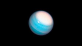 A Hubble photograph of Uranus taken in November shows the planet's north pole covered by a massive cloud.