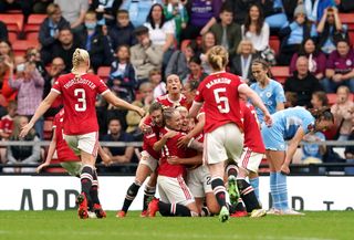 Manchester United's players celebrate Alessia Russo's goal