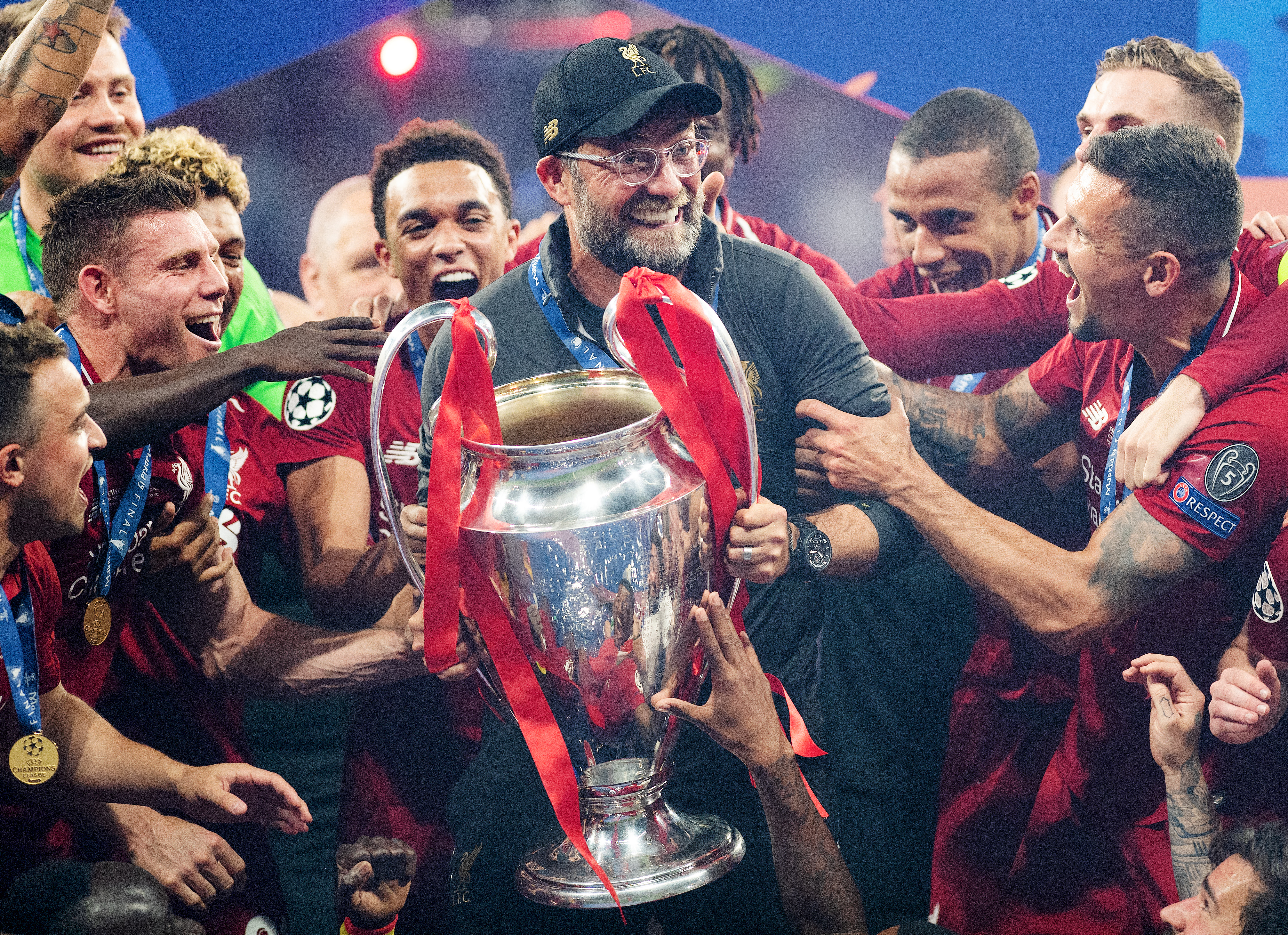 Jurgen Klopp lifts the Champions League trophy alongside his players after Liverpool's win in the Champions League final win against Tottenham in June 2019.