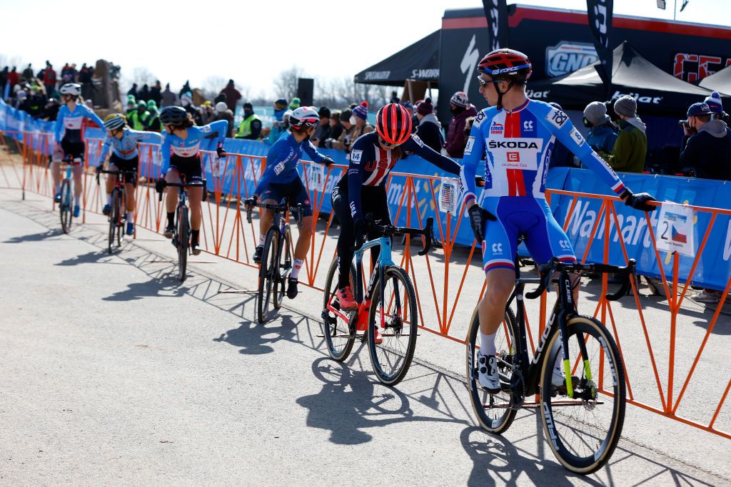 FAYETTEVILLE GEORGIA JANUARY 28 LR Madigan Munro of The United States and Michael Boros of Czech Republic wait to relieve his teammates during the 73rd UCI CycloCross World Championships Fayetteville 2022 Team Relay Fayetteville2022 on January 28 2022 in Fayetteville Georgia Photo by Chris GraythenGetty Images