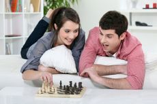 A couple plays chess