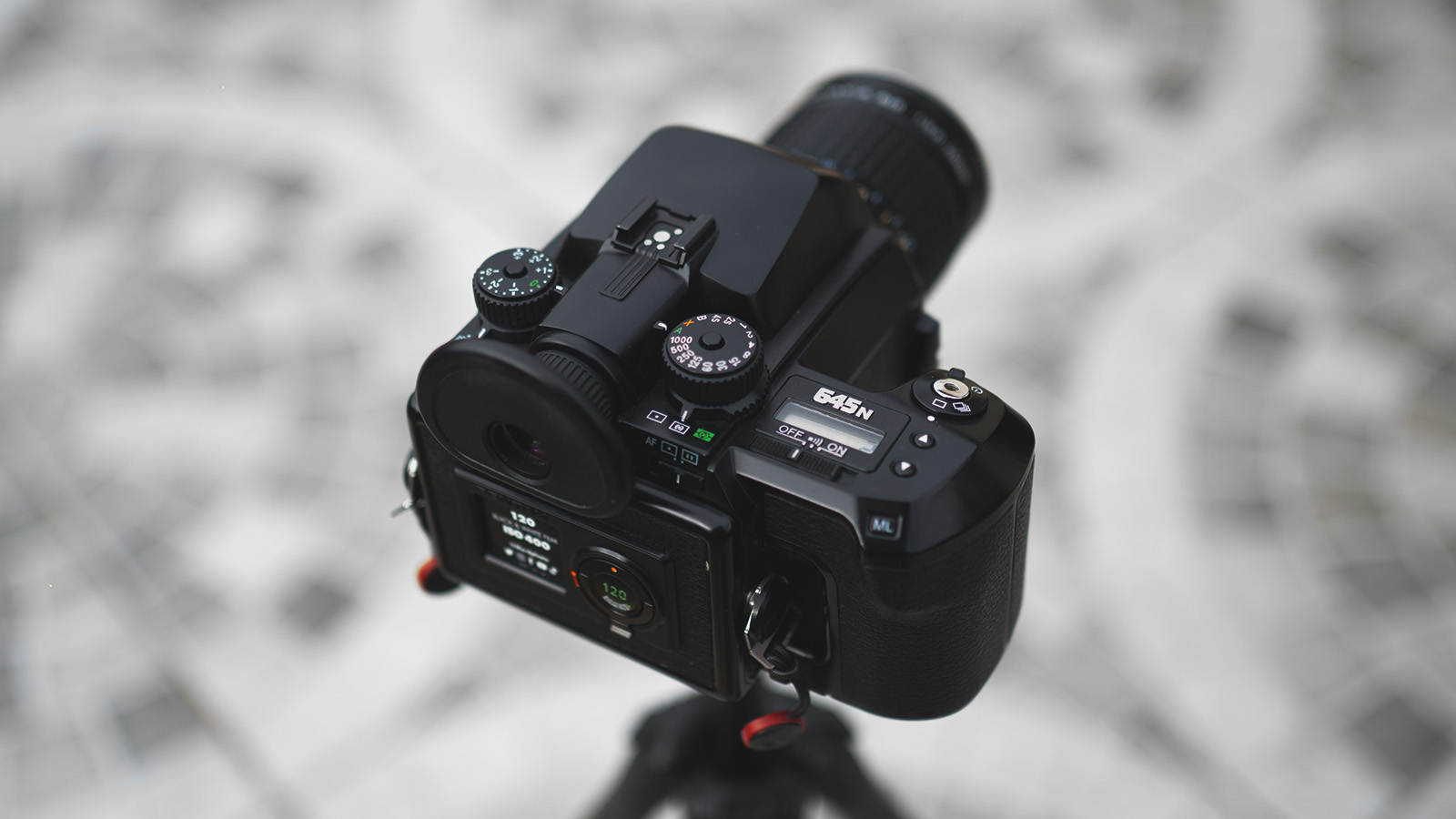 A medium format camera on a tripod.