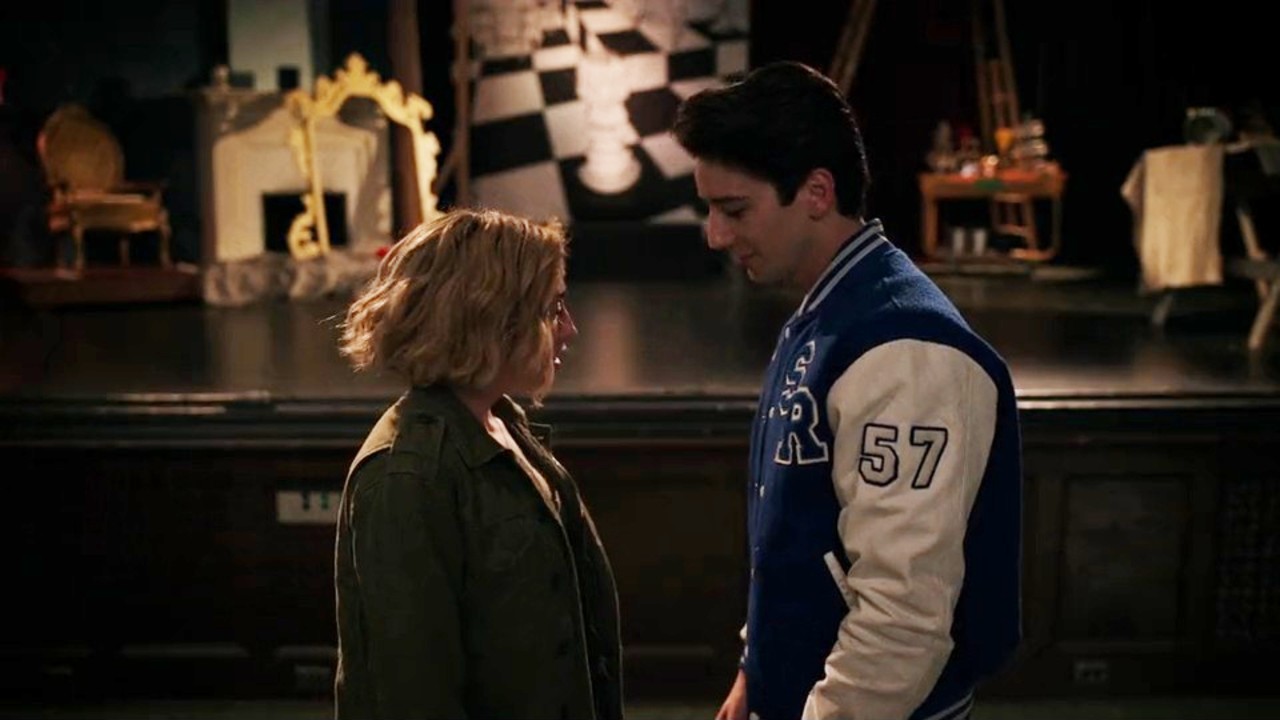 Milo Maheim and Peyton List look at each other in School Spirits.