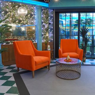 vibrant velvet sits alongside tropical print wallpapers and metallic furniture in cbb 18 house