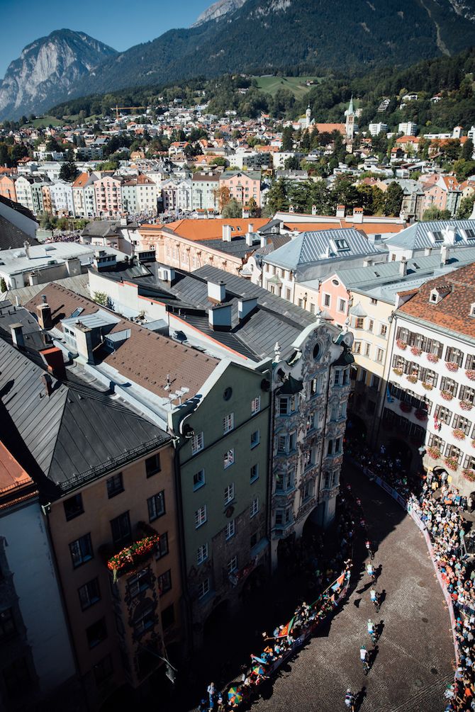 The peloton passes through the narrow streets of Innsbruck old town