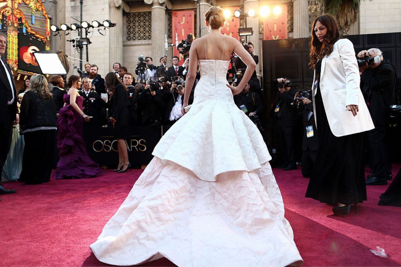 Jennifer Lawrence with her Oscar at the 2013 Oscar ceremony in the most expensive dress ever worn at the Oscars