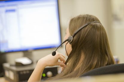 Woman wearing a headset working in a call center