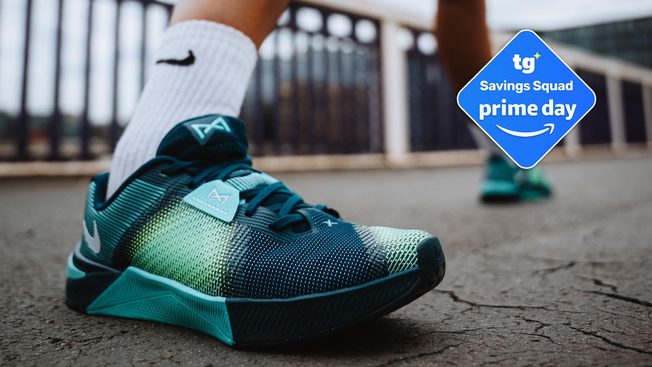 Nike Metcon 10 in teal with a deal badge top right
