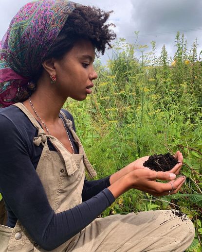 Poppy Okotcha in her garden