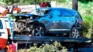 Tiger Woods' crashed car being recovered from the scene