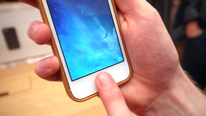 An iPhone 5S being unlocked via Touch ID