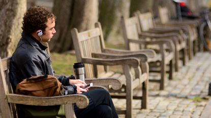 A man sits on a park bench in Philadelphia