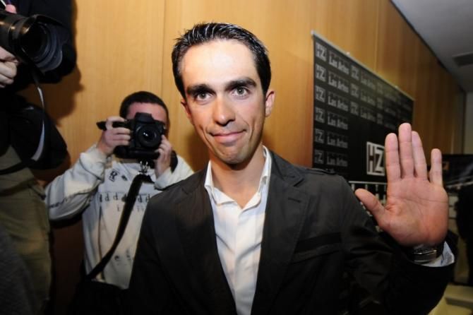 Alberto Contador waves after a press conference in Pinto having been suspended for two years by the Court of Arbitration for Sport