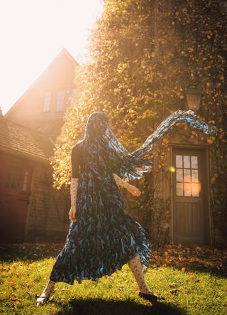 woman in dress layered with bodysuit