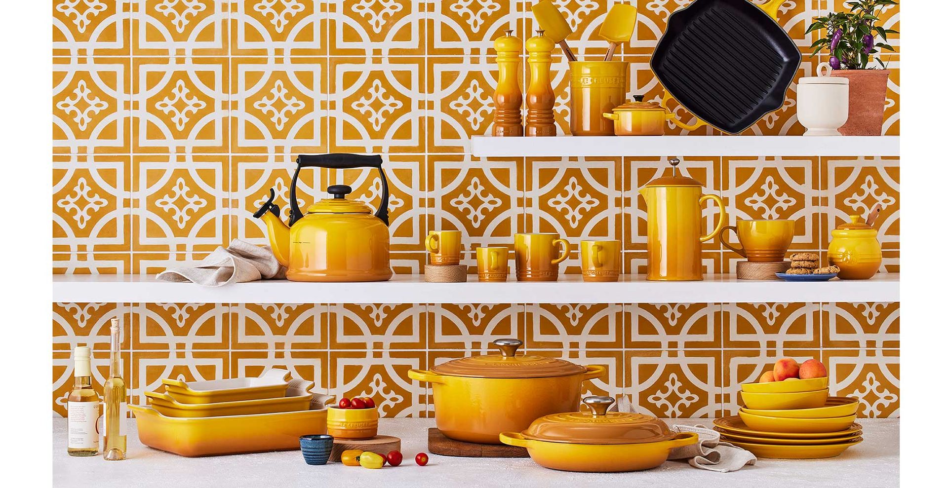 New Le Creuset Nectar colourway shownon stoneware collection on kitchen shelves