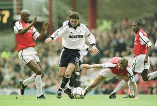 Tottenham's Luke Young is challenged by Arsenal pair Patrick Vieira and Tony Adams in March 2001.