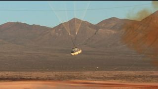 Boeing's CST-100 Starliner capsule float back down to Earth above the White Sands Missile Range in New Mexico following a successful pad abort test this morning. Today's mission was an uncrewed test of the spacecraft's abort system, which would bring astronauts to safety in the event of an anomaly during launch.