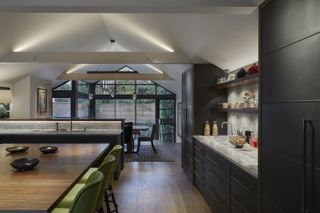 open plan kitchen and dining room zoned by lighting