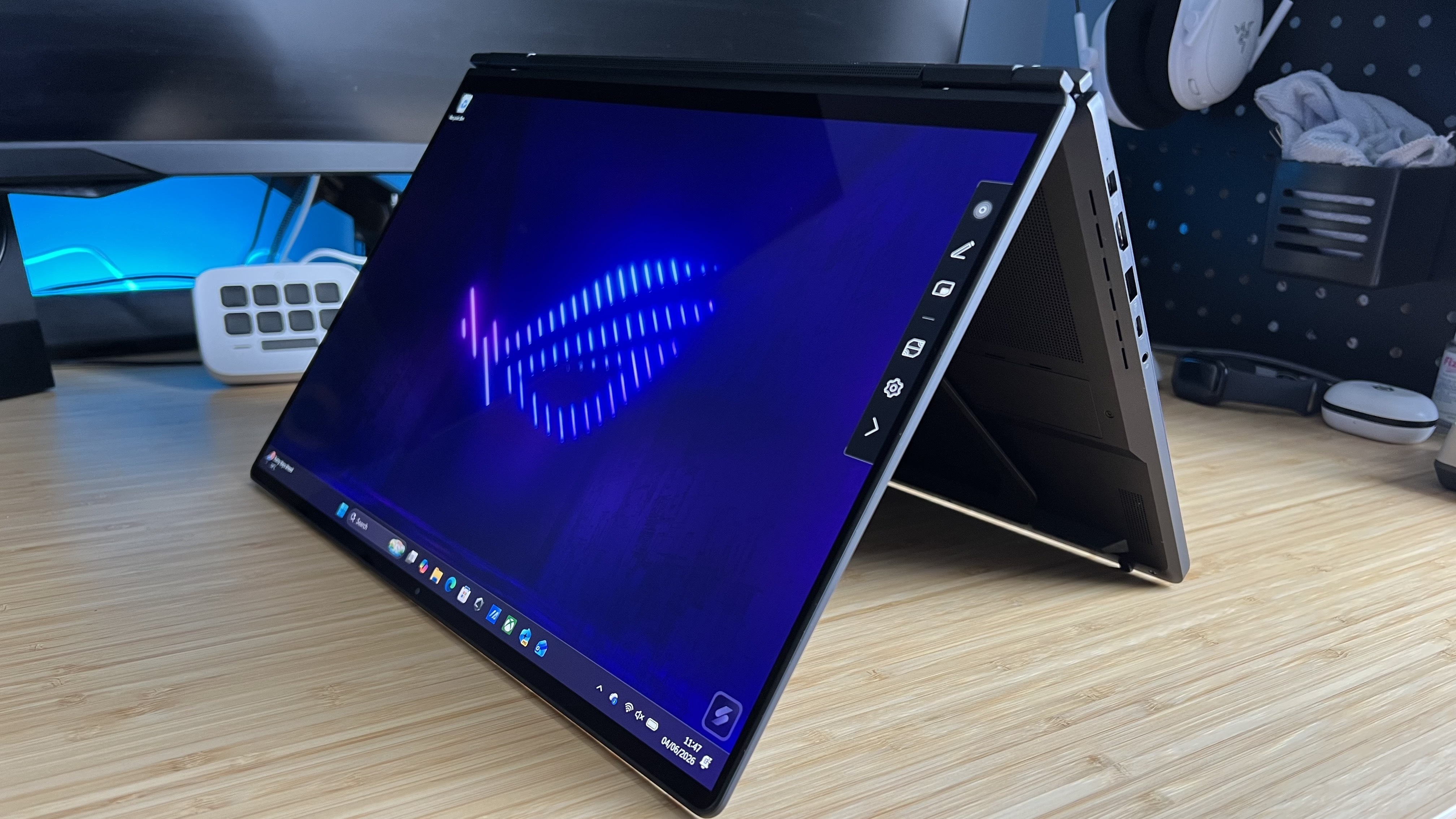 Asus ROG Zephyrus Duo in a tented position on a wooden desk