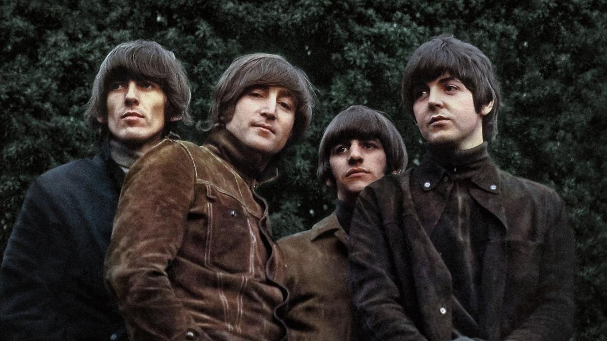 The Beatles pose for the cover photo of Rubber Soul, 1965