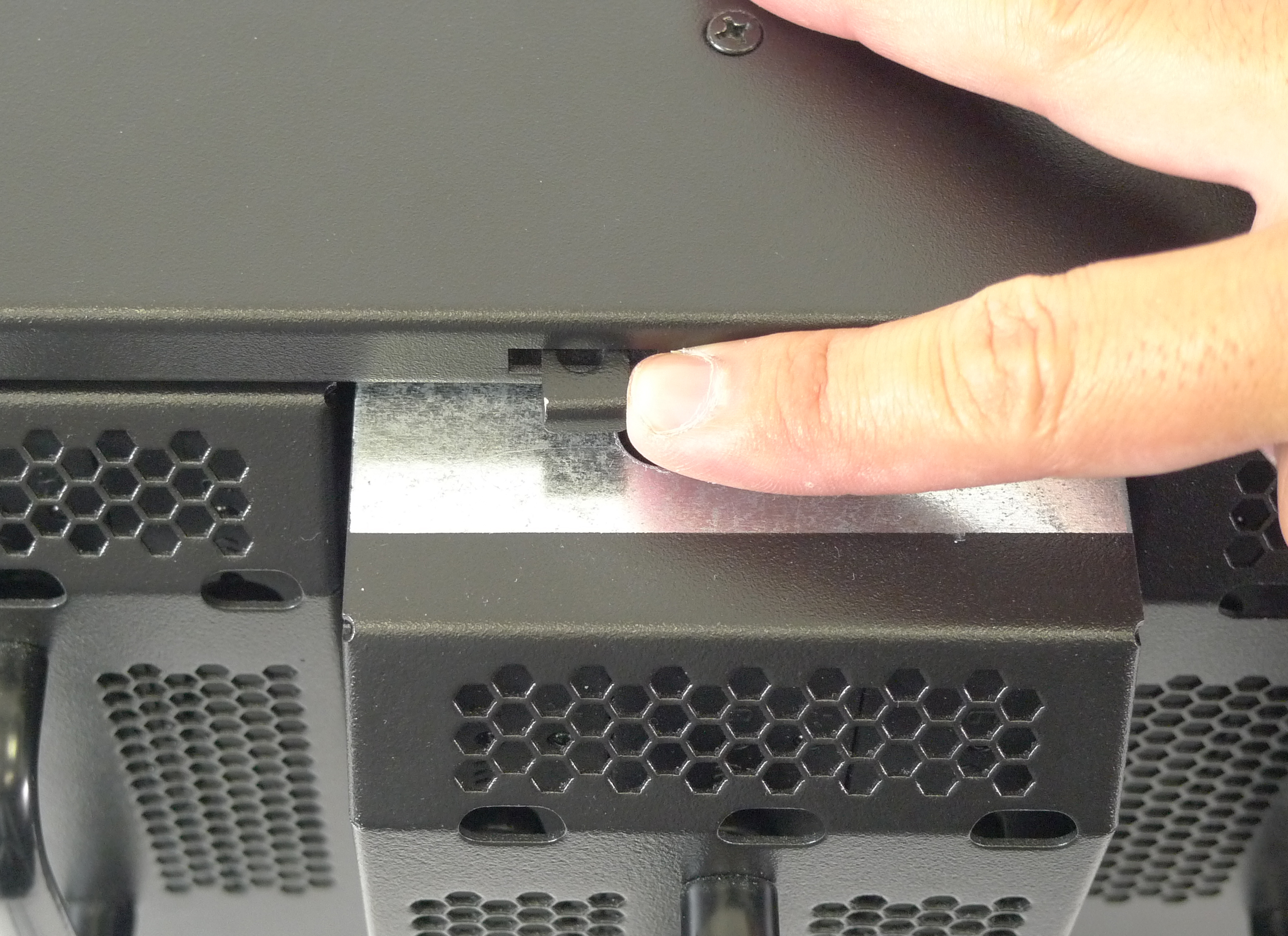 To remove a RAIDPac, you need to push the black release lever located above each of the docking bays on the RAIDFrame.