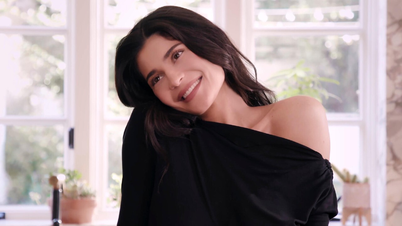 Kylie Jenner head tilted and smiling