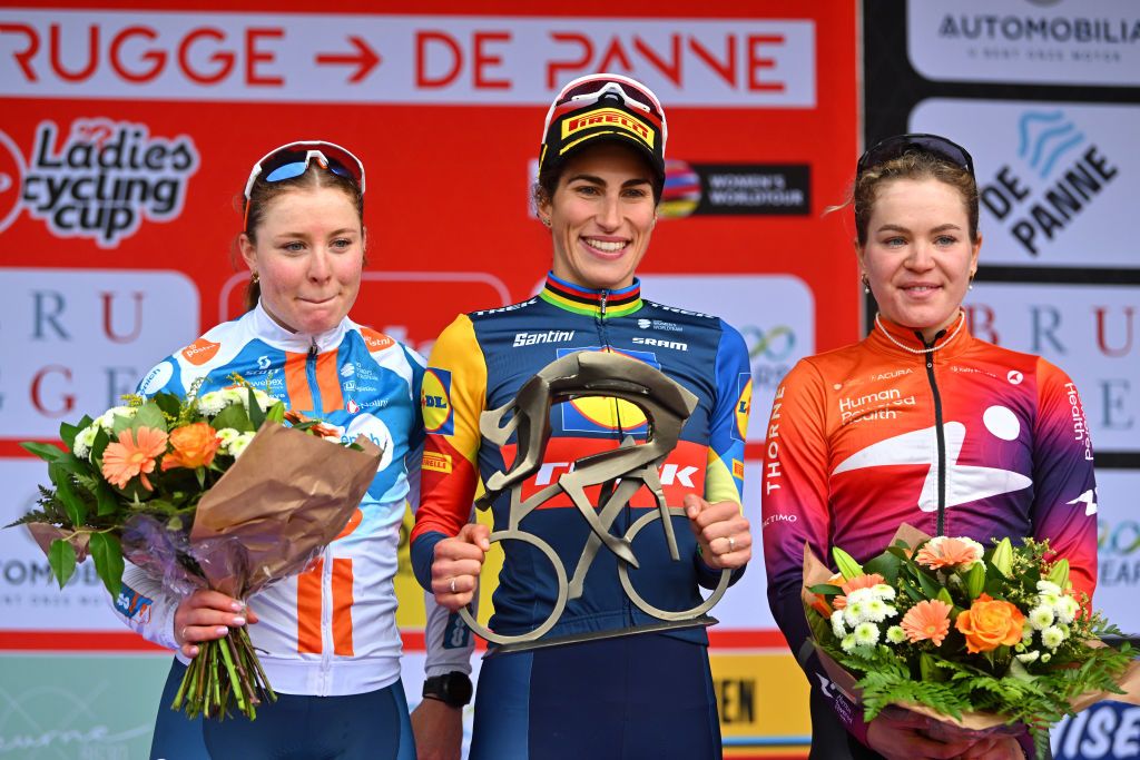 DE PANNE BELGIUM MARCH 21 LR Charlotte Kool of The Netherlands and Team dsmfirmenich PostNL on second place race winner Elisa Balsamo of Italy and Team Lidl Trek and Daria Pikulik of Poland and Team Human Powered Health on third place pose on the podium ceremony after the 7th Womens Classic BruggeDe Panne 2024 a 155km one day race from Brugge to De Panne on March 21 2024 in De Panne Belgium Photo by Luc ClaessenGetty Images