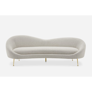 white curved sofa with legs