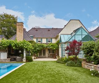 Exterior of 1930s LA home and backyard with pool and solarium