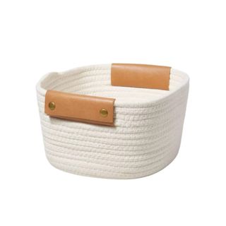 A white fabric storage basket