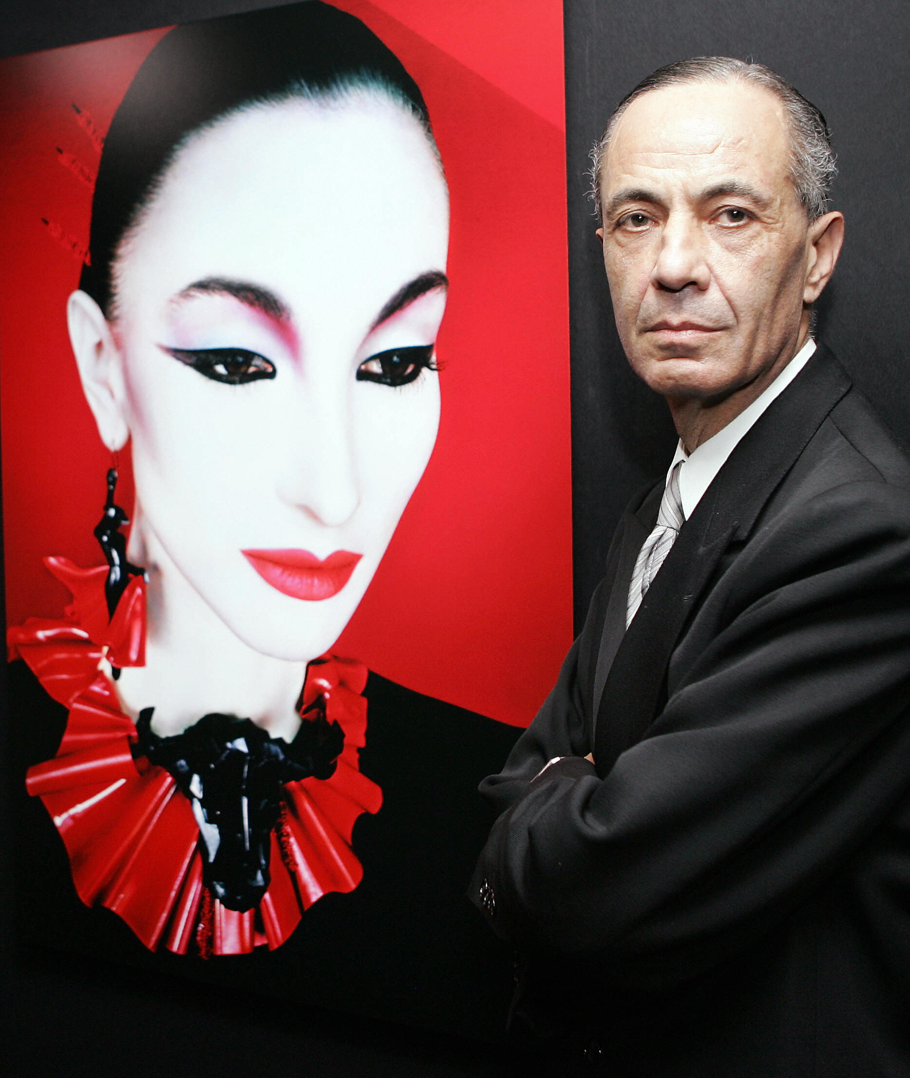Serge Lutens, beside a Shiseido beauty poster
