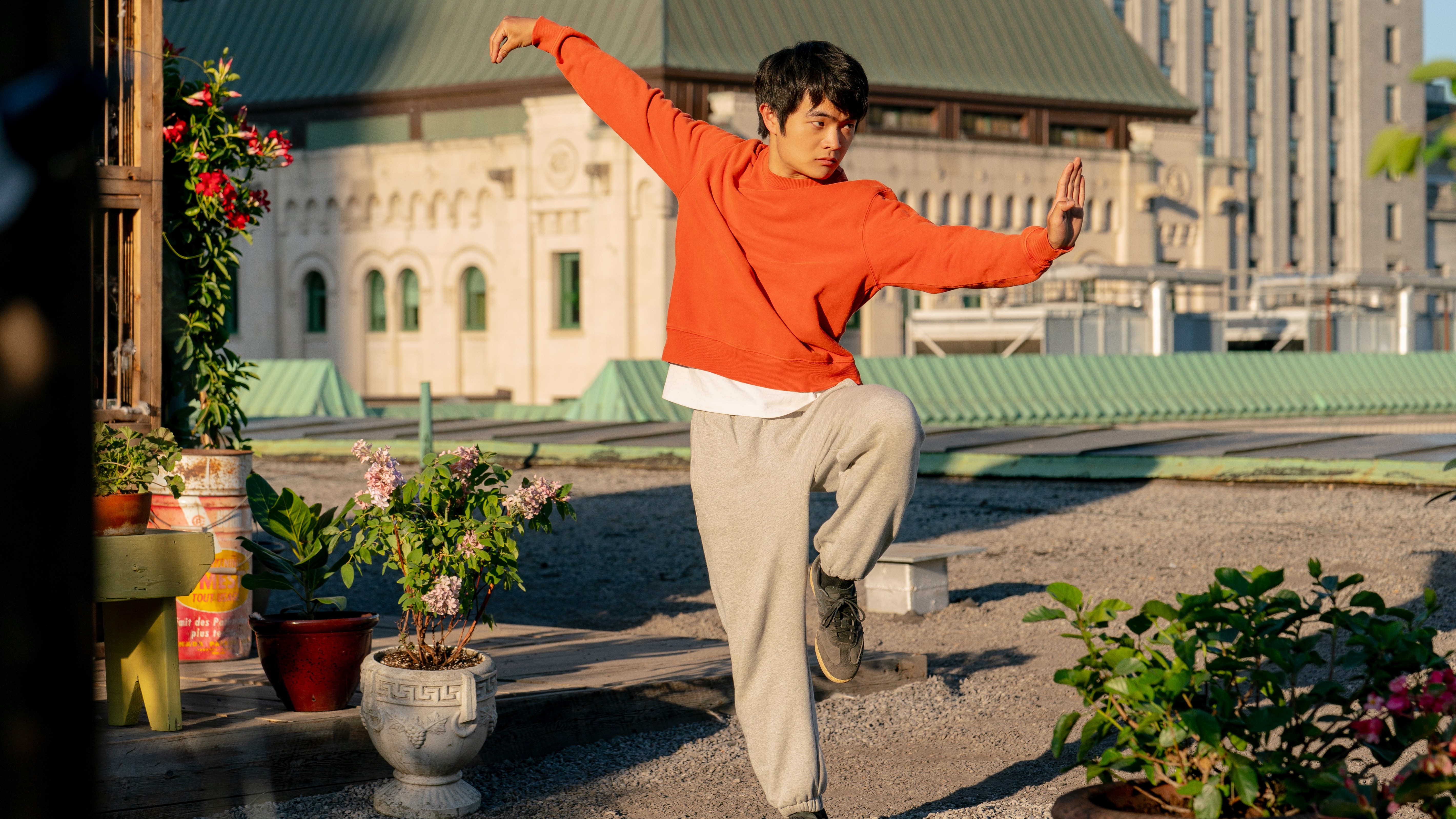 Li Fong (Ben Wang) poses on one leg in a scene from "Karate Kid: Legends"