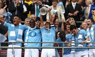 Carlos Tevez, centre, lifted the FA Cup with Manchester City in 2011