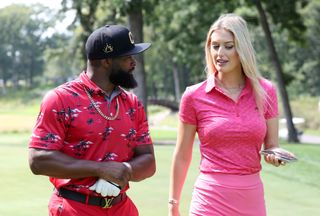 Bella Angel and Tyrone Woodley on the golf course