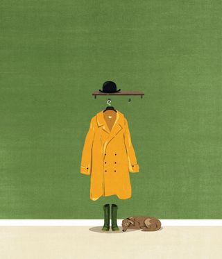 A black tophat on a brown floating shelf with a yellow coat hanging below. Below the yellow coat are green wellies with a sleeping dog on the side. Captured against a green wall