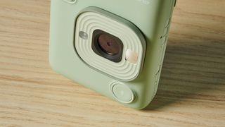 A matcha green Fujifilm Instax mini LiPlay 2-in-1 instant camera and printer